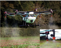 Drone spraying fertilizer over agricultural field